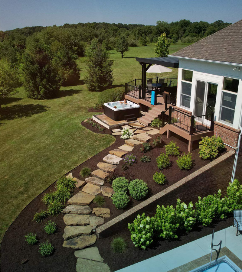 Create your own outdoor oasis by incorporating a hot tub into your landscape. A portable hot tub can be used year-round unlike a spa built-in next to your backyard pool.