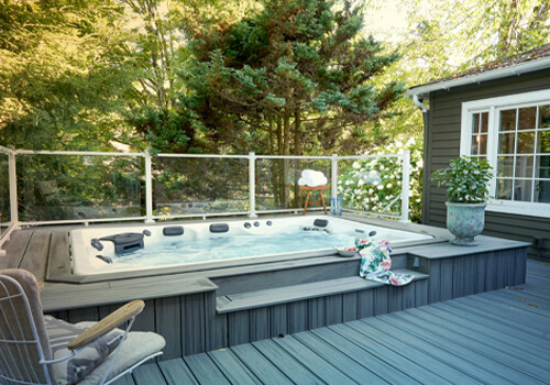 A Master Spas swim spa inset into a deck