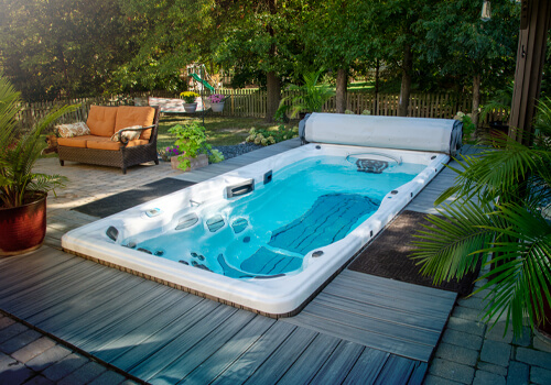 H2X Fitness Swim Spa by Master Spas inset into a deck