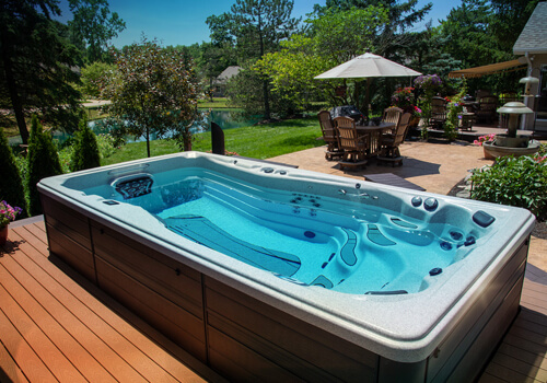 H2X Swim spa on a backyard patio