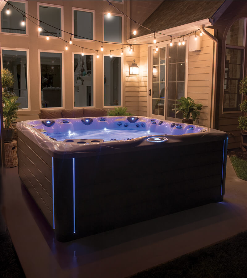 Hot Tub at Night. LED lighting adds a dramatic effect to the hot tub and surrounding patio.