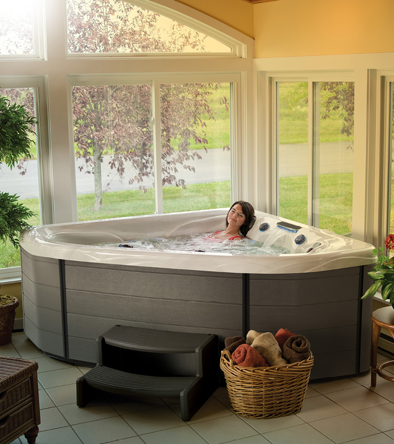 Indoor Hot Tub. A two-person hot tub can be installed in a sunroom or other indoor spot with proper ventilation.