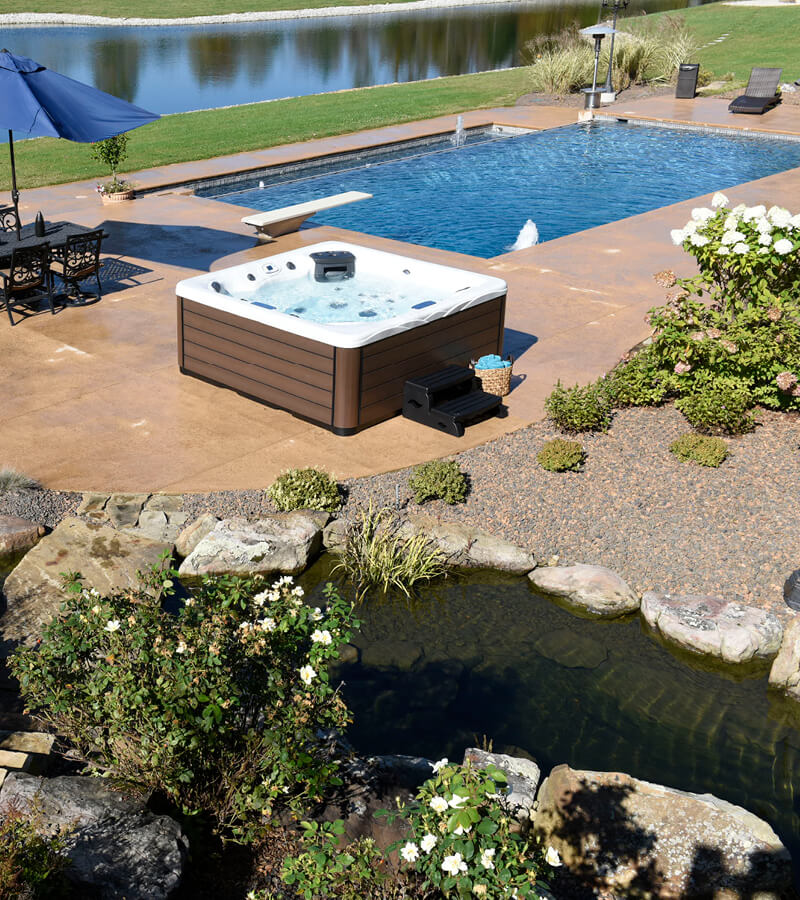 Pool and Spa. This resort-like backyard has an in-ground pool, separate hot tub, and patio seating.