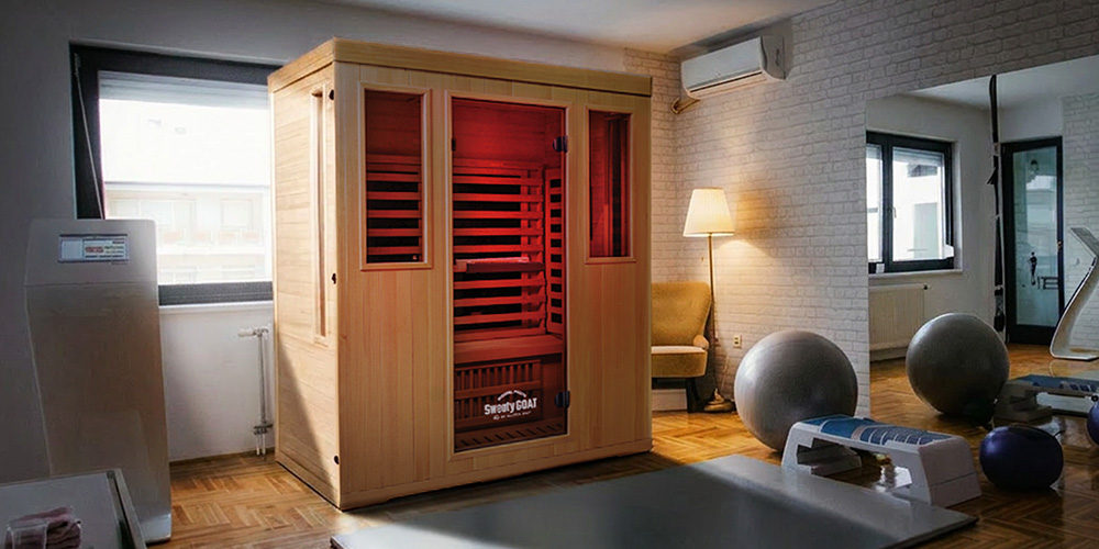 Angled view of a MP3 Sweaty GOAT sauna inside of a home gym.